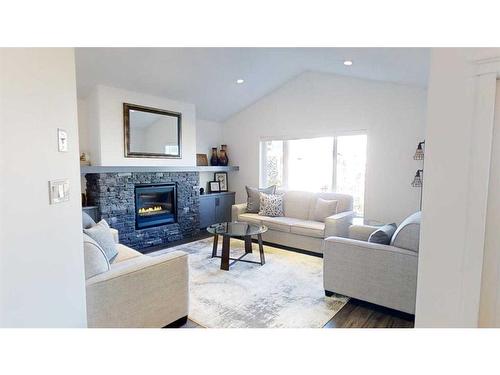 697 Sixmile Crescent South, Lethbridge, AB - Indoor Photo Showing Living Room With Fireplace