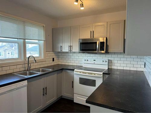 690 Florence Street, Pincher Creek, AB - Indoor Photo Showing Kitchen With Double Sink