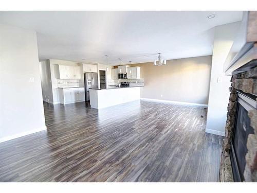 493 Devonia Way West, Lethbridge, AB - Indoor Photo Showing Living Room With Fireplace