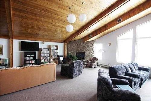 122-20 3 Street, Lethbridge, AB - Indoor Photo Showing Living Room With Fireplace