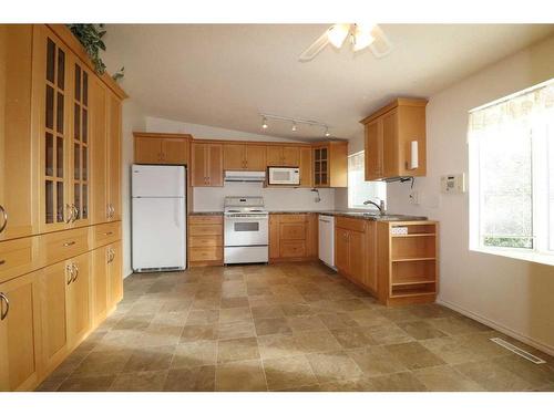 2718 7 Avenue North, Lethbridge, AB - Indoor Photo Showing Kitchen With Double Sink