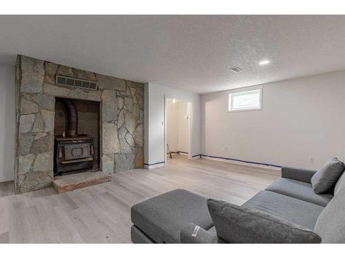 31033 Range Road 262, Cardston, AB - Indoor With Fireplace