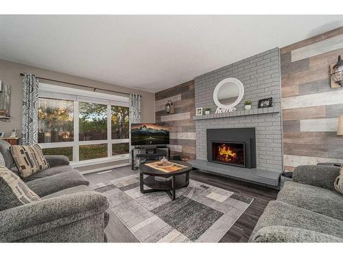 1501 Aspen Place South, Lethbridge, AB - Indoor Photo Showing Living Room With Fireplace