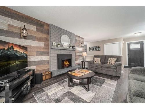 1501 Aspen Place South, Lethbridge, AB - Indoor Photo Showing Living Room With Fireplace