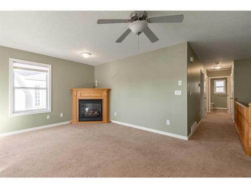 359 3 Avenue West, Cardston, AB - Indoor Photo Showing Living Room With Fireplace