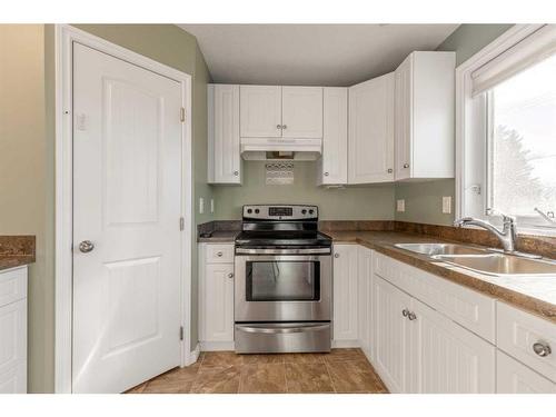 359 3 Avenue West, Cardston, AB - Indoor Photo Showing Kitchen With Double Sink