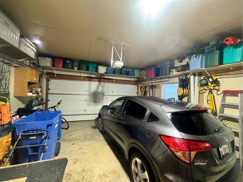 150 Heritage Close West, Lethbridge, AB - Indoor Photo Showing Garage