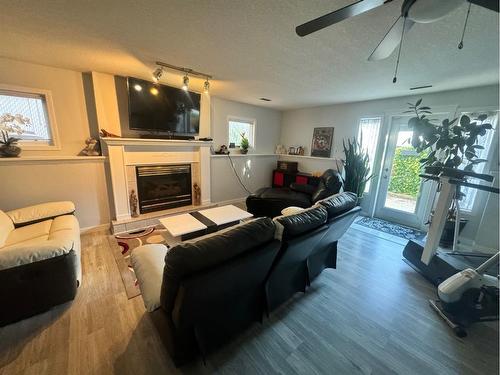 150 Heritage Close West, Lethbridge, AB - Indoor Photo Showing Living Room With Fireplace