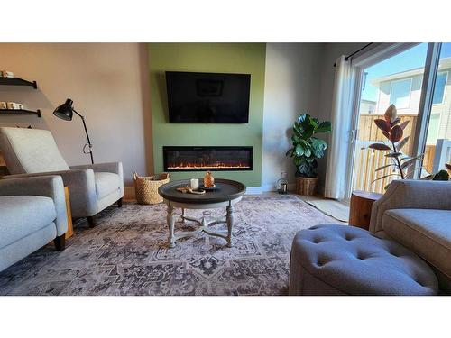 4617 26 Avenue South, Lethbridge, AB - Indoor Photo Showing Living Room With Fireplace