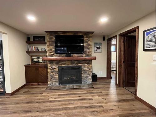 214 Falcon Ridge Way, Rural Lethbridge County, AB - Indoor Photo Showing Living Room With Fireplace