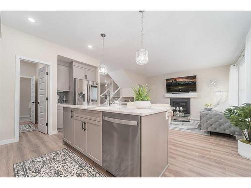 665 Aquitania Boulevard West, Lethbridge, AB - Indoor Photo Showing Kitchen With Fireplace