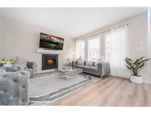 665 Aquitania Boulevard West, Lethbridge, AB - Indoor Photo Showing Living Room With Fireplace