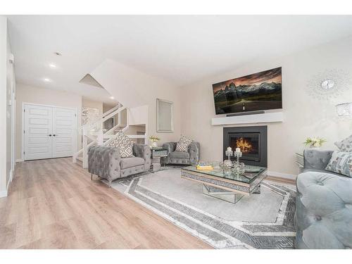 665 Aquitania Boulevard West, Lethbridge, AB - Indoor Photo Showing Living Room With Fireplace