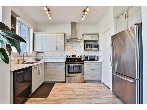 310 Coalbanks Boulevard West, Lethbridge, AB - Indoor Photo Showing Kitchen With Double Sink With Upgraded Kitchen