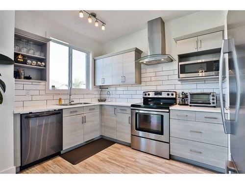 310 Coalbanks Boulevard West, Lethbridge, AB - Indoor Photo Showing Kitchen With Double Sink With Upgraded Kitchen