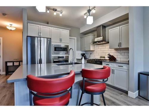 115 Moonlight Boulevard West, Lethbridge, AB - Indoor Photo Showing Kitchen With Double Sink With Upgraded Kitchen