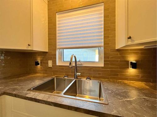 150 Oxford Road West, Lethbridge, AB - Indoor Photo Showing Kitchen With Double Sink