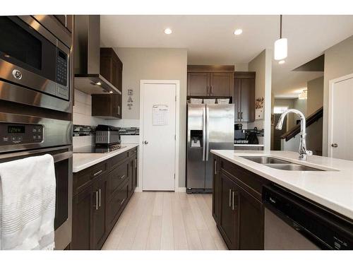 44 Alma Isobell Hodder Crescent North, Lethbridge, AB - Indoor Photo Showing Kitchen With Double Sink