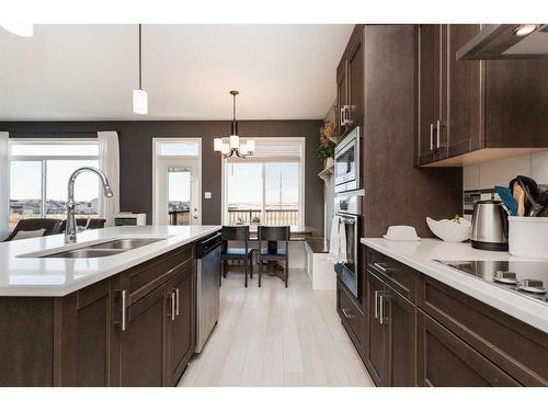 44 Alma Isobell Hodder Crescent North, Lethbridge, AB - Indoor Photo Showing Kitchen With Double Sink