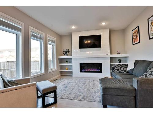 736 Coalbrook Close West, Lethbridge, AB - Indoor Photo Showing Living Room With Fireplace