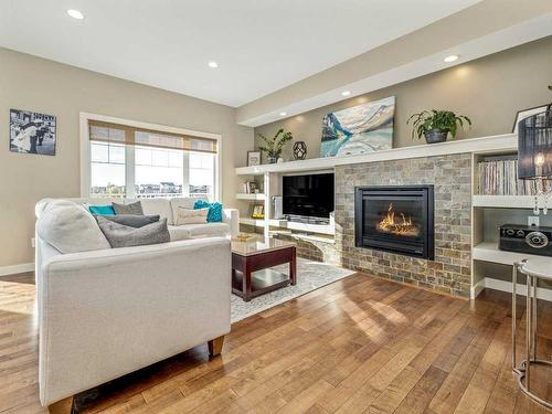 92 Firelight Way West, Lethbridge, AB - Indoor Photo Showing Living Room With Fireplace