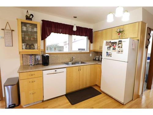 4813 50 Avenue, Taber, AB - Indoor Photo Showing Kitchen With Double Sink