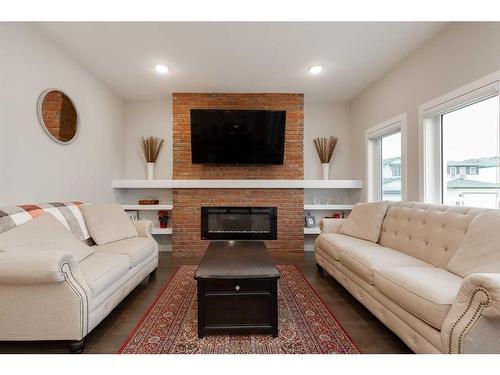 601 Bluebell Bay West, Lethbridge, AB - Indoor Photo Showing Living Room With Fireplace