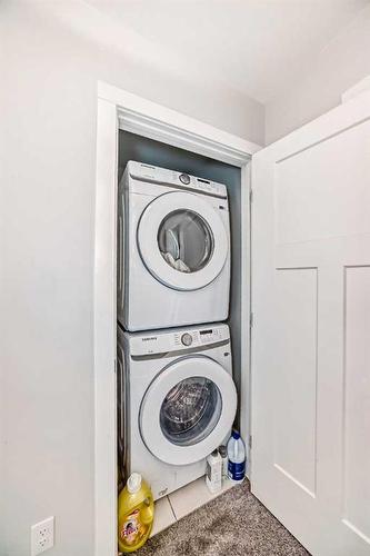 23 Country Meadows Boulevard West, Lethbridge, AB - Indoor Photo Showing Laundry Room