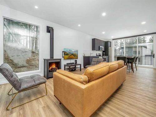 214 Southmore Place, Blairmore, AB - Indoor Photo Showing Living Room With Fireplace