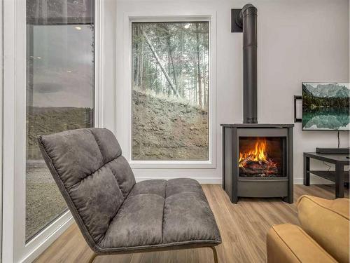 214 Southmore Place, Blairmore, AB - Indoor Photo Showing Living Room With Fireplace