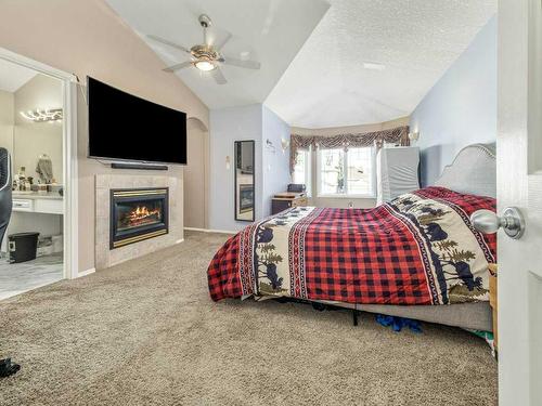 355 Fairmont Boulevard South, Lethbridge, AB - Indoor Photo Showing Bedroom With Fireplace