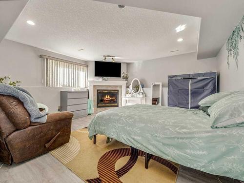 355 Fairmont Boulevard South, Lethbridge, AB - Indoor Photo Showing Bedroom With Fireplace