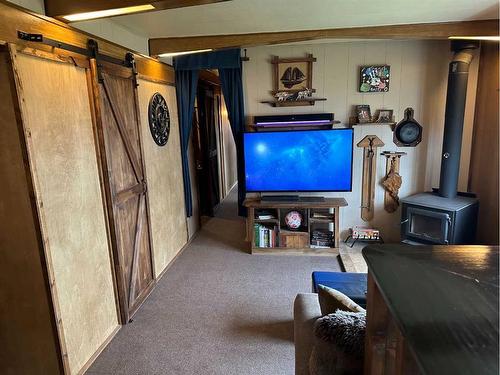 619 5A Avenue, Vauxhall, AB - Indoor Photo Showing Other Room With Fireplace