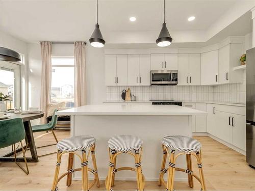 64 Blackwolf Lane North, Lethbridge, AB - Indoor Photo Showing Kitchen With Upgraded Kitchen