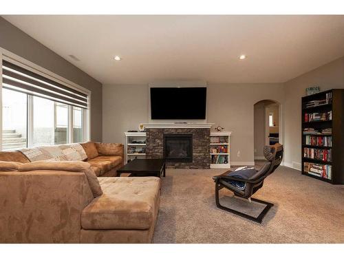 2413 Aspen Drive, Coaldale, AB - Indoor Photo Showing Living Room With Fireplace