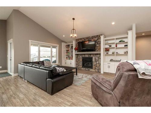 2413 Aspen Drive, Coaldale, AB - Indoor Photo Showing Living Room With Fireplace