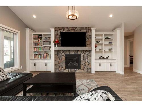 2413 Aspen Drive, Coaldale, AB - Indoor Photo Showing Living Room With Fireplace