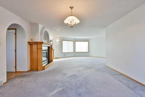 3019 48Th Avenue South, Lethbridge, AB - Indoor Photo Showing Other Room With Fireplace