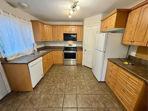 2014 14 Avenue South, Lethbridge, AB - Indoor Photo Showing Kitchen With Double Sink