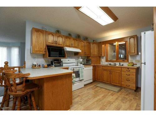 4106 Heritage Drive, Taber, AB - Indoor Photo Showing Kitchen With Double Sink