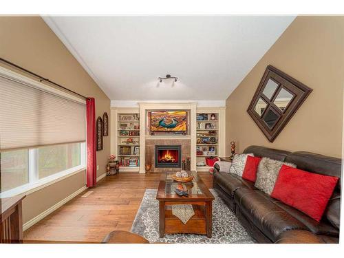 91 Gateway Mews South, Lethbridge, AB - Indoor Photo Showing Living Room With Fireplace