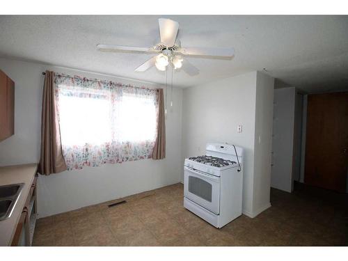 2412 5A Avenue North, Lethbridge, AB - Indoor Photo Showing Kitchen With Double Sink