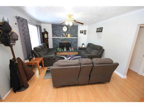 5320 43 Ave., Taber, AB - Indoor Photo Showing Living Room With Fireplace