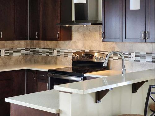 470 Mt Sundance Landing West, Lethbridge, AB - Indoor Photo Showing Kitchen With Upgraded Kitchen