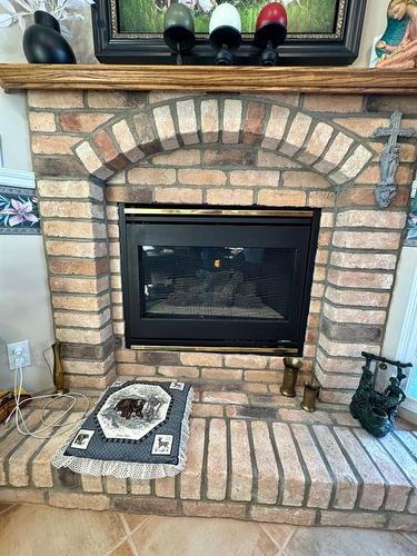 22 Fairmont Bay South, Lethbridge, AB - Indoor Photo Showing Living Room With Fireplace