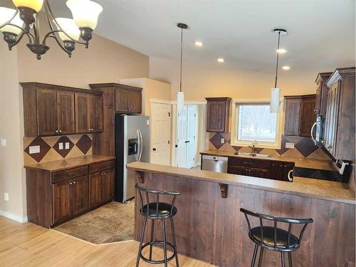 502 Centennial Avenue, Nobleford, AB - Indoor Photo Showing Kitchen With Double Sink