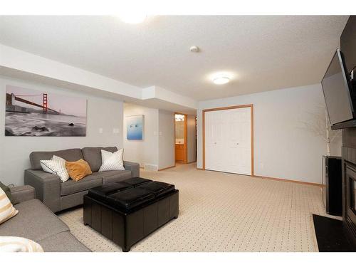 30 Chilcotin Way West, Lethbridge, AB - Indoor Photo Showing Living Room With Fireplace