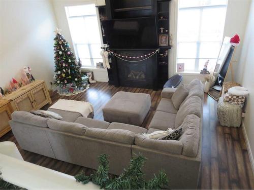 843 Mt Sundance Manor West, Lethbridge, AB - Indoor Photo Showing Living Room With Fireplace