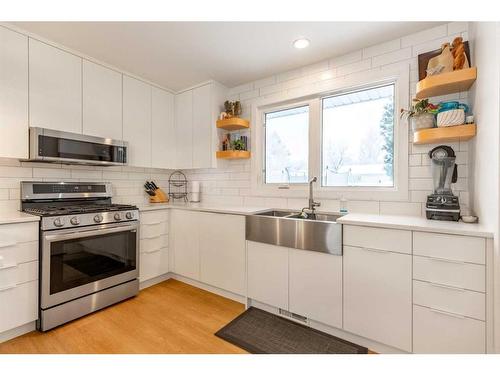 239 52 Avenue, Coalhurst, AB - Indoor Photo Showing Kitchen With Double Sink