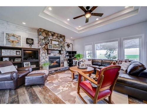 100049 Rng Rd 184, Taber, AB - Indoor Photo Showing Living Room With Fireplace